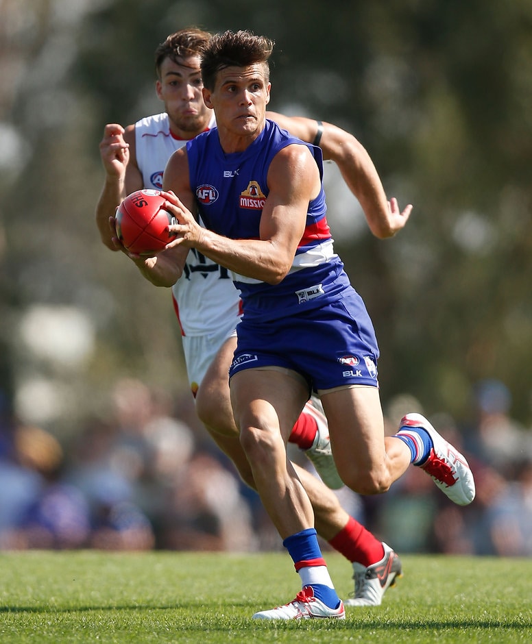 AFL 2016 NAB Challenge - Western Bulldogs v Melbourne MELBOURNE, AUSTRALIA - MARCH 6: Jed Adcock of the Bulldogs in action during the 2016 NAB Challenge match between the Western Bulldogs and the Melbourne Demons at Highgate Recreational Reserve, Craigieburn on March 6, 2016. (Photo by Michael Willson/AFL Media)